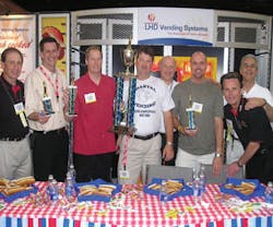Representatives of ACE joined LHD Vending in honoring the winners of the company&rsquo;s hot dog eating contest, which took place on the show floor. At left are: Alan Plaisted, Southern Refreshment Services, Tucker, Ga., ACE representative; Darrell Sims, Southern Refreshment Services, representing Georgia, 4th place; John Fourqurean, Gallins Vending Service, Winston/Salem, N.C., representing North Carolina, 2nd place; Jason Mims, Coastal Vending &amp; Food Service, Charleston, S.C., representing South Carolina, 1st place; Leon Leykin, LHD Vending; Geoff Cook, RE Services Inc., Chesapeake, Va., representing Virginia, 3rd place; John Trego, Coastal Vending &amp; Food Service, ACE representative; and Greg Westnedge, LHD Vending.