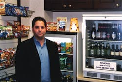 Aaron Speagle of Piedmont Vending Inc. checks on a Freedom Shopping kiosk. Aaron Speagle of Piedmont Vending Inc. checks on a Freedom Shopping kiosk.