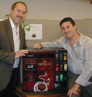 Porcelli explains the Gevalia machine to Drew Warner, American Vending Coffee Service, Mt. Freedom, N.J.