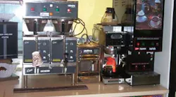A downtown coffee shop serviced by Karsay Coffee has a grinder, a batch brewer, an espresso machine, an automatic drip brewer and a powdered cappuccino dispenser.
