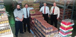 At left, Steve Hall, Jr., Steve Hall, Sr., Ron Baum and Tom Ries display the cold drink variety that enhances Firelands Vending&rsquo;s reputation.