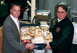 Joe Cordaro, left, and Pete Cordaro proudly display CRH Catering Co.&rsquo;s food variety.