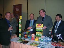 Rick Pavlic, left, Pavlic Vending Service Inc. in Waukesha, Wis., chats with Phil Sipka, Bob Shindle and Scott Bidding of DeMitri Chesapeake Sales Inc., Turnersville, N.J. at the tabletop exhibit during the Coffee Summit at the Crowne Plaza Hotel in Cherry Hill, N.J.
