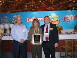 Paul Schindelar (right), Kraft Vending &amp; OCS, honors the Automatic Merchandiser 2008 Route Driver of the Year, Nina Williams, and general manager Larry Pugh, Mid-South Food Services, Aberdeen, N.C.