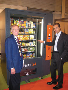 Davide Sartori of Daint, right, demonstrates the SELFMAT 24 to Jim Phleps of CompuShop Services LLC of Edina, Minn.