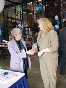 Edith Leonian, left, of Concession Services Inc. greets Diana Tomaskas, food business representative of DPI Midwest, based in Arlington Heights, Ill.