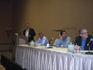 Panelists field a question. At left are Glen Butler of Crane Merchandising Systems, moderator Mike Kasavana of Michigan State University, Greg Hasslinger of InOne Technology, Anant Agrawal of Cantaloupe Systems, and Doug Haddon of MEI.