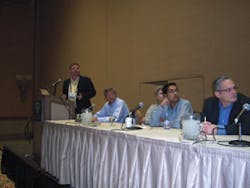 Panelists field a question. At left are Glen Butler of Crane Merchandising Systems, moderator Mike Kasavana of Michigan State University, Greg Hasslinger of InOne Technology, Anant Agrawal of Cantaloupe Systems, and Doug Haddon of MEI. Panelists field a question. At left are Glen Butler of Crane Merchandising Systems, moderator Mike Kasavana of Michigan State University, Greg Hasslinger of InOne Technology, Anant Agrawal of Cantaloupe Systems, and Doug Haddon of MEI.