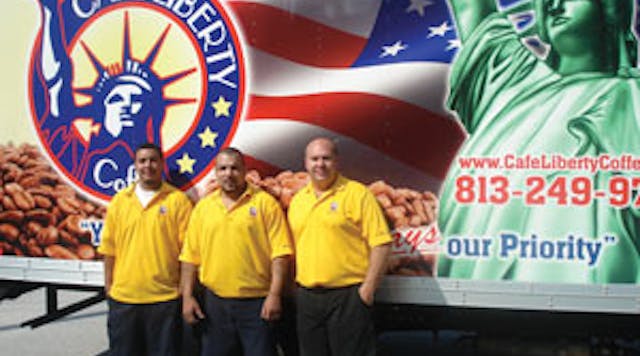 Angel Roman, left, and his father, Luis Figueroa, are also from New York. They join Frank in front of a delivery truck bearing a patriotic logo. Many of the company&rsquo;s customers moved to Florida from the New York metro area.