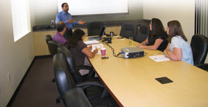 Paresh Patel, owner, meets weekly with his management team. At left are: Nemisha Patel, service manager; Dean Moore, route manager; Kim Hellner, account executive; Angie Hobbs, inventory and purchasing specialist. Not pictured is Lisa Huddleston, special assistant to the president.