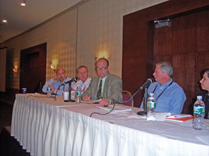At left, Steve Silha of LaVazza Premium Coffee Corp., Mike Jones of john conti Coffee Co., Kevin Daw of KNJ Sales and Paul Schindelar of Kraft Foods field questions from the audience in Cherry Hill, N.J.