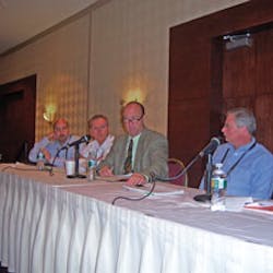 At left, Steve Silha of LaVazza Premium Coffee Corp., Mike Jones of john conti Coffee Co., Kevin Daw of KNJ Sales and Paul Schindelar of Kraft Foods field questions from the audience in Cherry Hill, N.J.