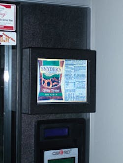 A video screen on a vending machine displays nutrition information for a product with high nutritional value. A video screen on a vending machine displays nutrition information for a product with high nutritional value.