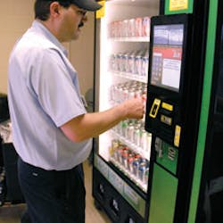Lee Lynn of Sanese Services checks on a Quickstore24 machine the company operates in Columbus, Ohio.