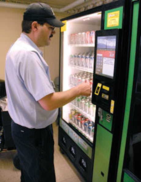 Lee Lynn of Sanese Services checks on a Quickstore24 machine the company operates in Columbus, Ohio.