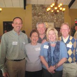 At left, Bill Nowak, Linda Vanderberg, Mike Dugan, Peggy Uhl and Scott Rorah of Michigan Merchandisers welcome guests.