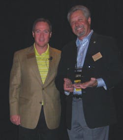 ? Howard Chapman, Royal Cup Inc. in Birmingham, Ala., left, the incoming National Automatic Merchandising Association (NAMA) coffee committee chairman, presents a plaque of appreciation to Pete Tullio, Jr., Gourmet Coffee Service in Van Nuys, Calif., the outgoing coffee committee chairman during the NAMA CoffeeShow at Bally’s Hotel and Casino in Las Vegas. ? Howard Chapman, Royal Cup Inc. in Birmingham, Ala., left, the incoming National Automatic Merchandising Association (NAMA) coffee committee chairman, presents a plaque of appreciation to Pete Tullio, Jr., Gourmet Coffee Service in Van Nuys, Calif., the outgoing coffee committee chairman during the NAMA CoffeeShow at Bally’s Hotel and Casino in Las Vegas.