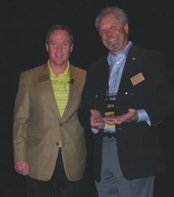 ? Howard Chapman, Royal Cup Inc. in Birmingham, Ala., left, the incoming National Automatic Merchandising Association (NAMA) coffee committee chairman, presents a plaque of appreciation to Pete Tullio, Jr., Gourmet Coffee Service in Van Nuys, Calif., the outgoing coffee committee chairman during the NAMA CoffeeShow at Bally&rsquo;s Hotel and Casino in Las Vegas.