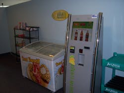 The self checkout kiosk has a touchscreen that runs programmed advertising. The self checkout kiosk has a touchscreen that runs programmed advertising.