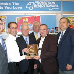 Michael Franceschino, second from the left, and Jim Finelli, fifth from the left, of The Promotion In Motion Companies, Inc. present the award for exceptional sales growth in 2010 on the East Coast to Michael Kelley, left, Lou Pace, Sr.; Jim Saunders and Bob Myers, Jr. of Quality Brokerage Inc. in Turnersville, N.J.