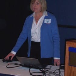 Sandra Larson addresses the government symposium during the NAMA OneShow.