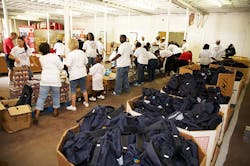 Claremont, North Carolina, volunteers joined with the Second Harvest Food Bank of Metrolina to fill 1,500 take-home backpacks with food for needy children. Claremont, North Carolina, volunteers joined with the Second Harvest Food Bank of Metrolina to fill 1,500 take-home backpacks with food for needy children.