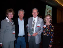 Becky and Joe Palazzola, left, of A Matter of Taste in Northridge, Calif., congratulate Hal and Diane Steuber, co-founders of Associated Coffee Services Inc. in San Leandro, Calif. Hal Steuber holds the 2011 NAMA Coffee Legends Award.