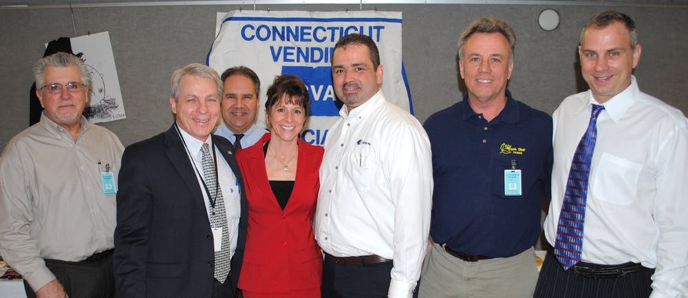 Participating in The Connecticut Vending Association&rsquo;s day at the Capitol are, at left: John Derrick, Burdette &amp; Beckman, Manchester, Conn.; State Sen. Len Suzio, R- Meriden, Conn,; Mike Santos, Harold W. Young Inc., Natick, Mass.; Sharon Connors, Vistar Corp., East Windsor, Conn.; Mark Lathrop, Lathrop Vending, Uncasville, Conn.; Scott Miller, Maple Hill Farms, Bloomfield, Conn. and Eric Mueller, United Snack Group, Cheshire, Conn.
