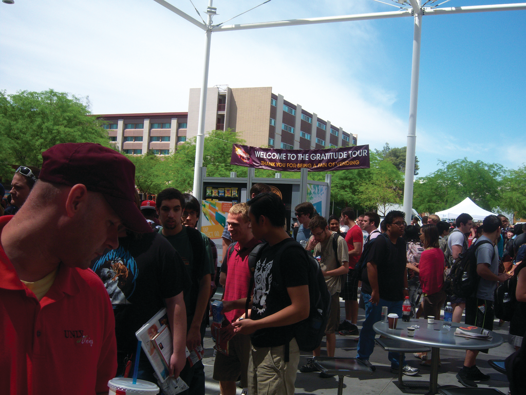 Students converge on the outdoor courtyard of the University of Nevada student union to sample free products and see new vending technology.