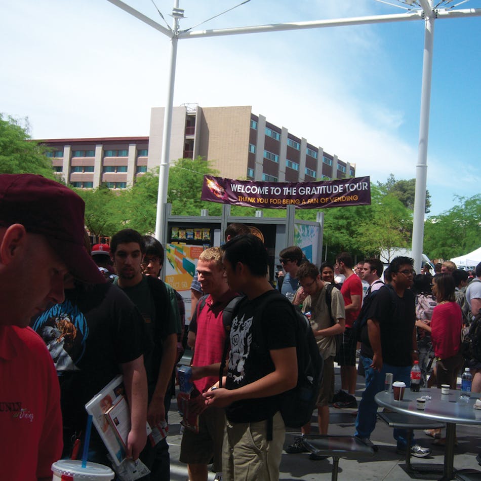 Students converge on the outdoor courtyard of the University of Nevada student union to sample free products and see new vending technology.