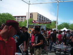 Students converge on the outdoor courtyard of the University of Nevada student union to sample free products and see new vending technology. Students converge on the outdoor courtyard of the University of Nevada student union to sample free products and see new vending technology.