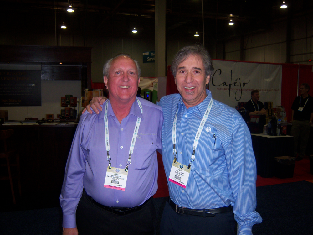 Dave Harrison, left, Platinum Coffee Service, Cypress, Texas, shares notes with Elliott Slutzky, Coffee Unlimited, Chicago, Ill.