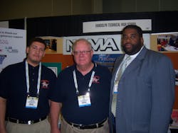 Jim Clark, center, program instructor for the vending repair program at Randolph Technical High School in Philadelphia, Pa., attends the OneShow with student Jancarlos Rosario and principal Darryl Overton.