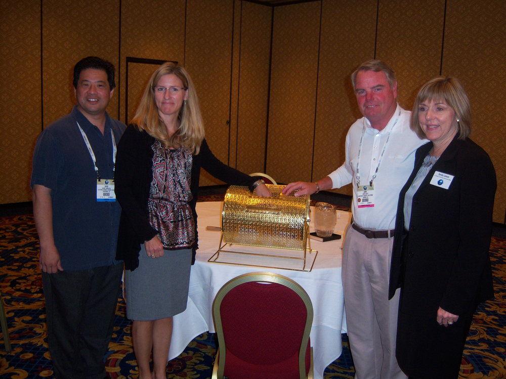 Drawing scholarship winners are, at left: Dave Yamauchi, Tri Star Vending, Calhambra, Calif., president of the California Automatic Vendors Council (CAVC), Jennifer Snyder, CAVC lobbyist, Jerry Scott, Canteen of Coastal California, Oxnard, Calif., president of the CAVC scholarship foundation, and Sandy Larson, senior director and counsel for government affairs at the National Automatic Merchandising Association.