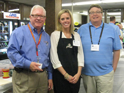 Marcus Connolly, left, and Meagan Radziej of Carlin O'Brien, a food brokerage, join Kurk Johnson of Lieberman Companies during the vending and food show.
