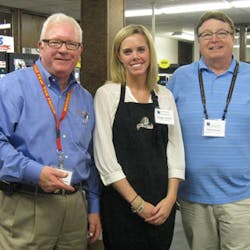 Marcus Connolly, left, and Meagan Radziej of Carlin O&apos;Brien, a food brokerage, join Kurk Johnson of Lieberman Companies during the vending and food show.