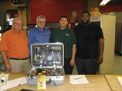 Jancarlos Rosario, third from the left, is awarded a complete set of vending tools, congratulating him are Jim Clark, left, Bud Burke, and Darryl Overton.