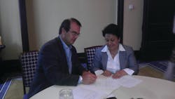 SCAA President Max Quirin, left, signed a letter of understanding in support of women in the coffee trade, with IWCA President Grace Mena. SCAA President Max Quirin, left, signed a letter of understanding in support of women in the coffee trade, with IWCA President Grace Mena.