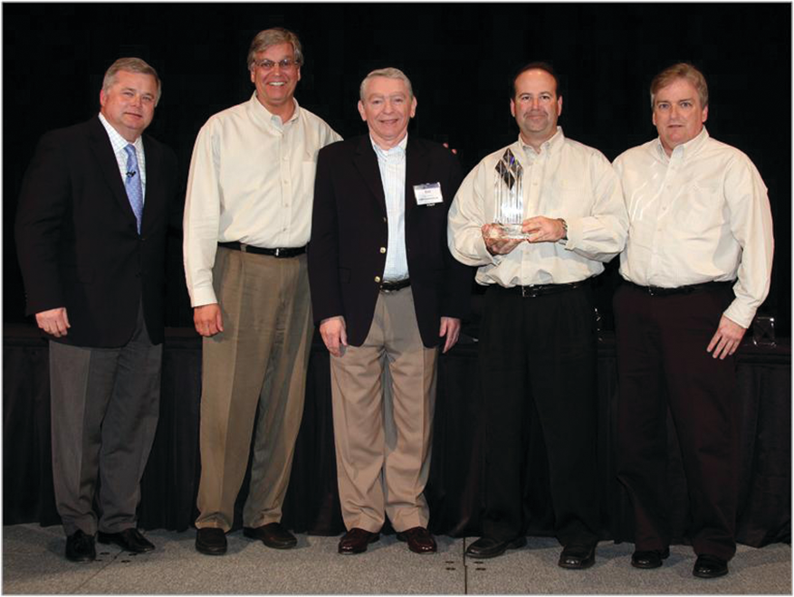 At the awards presentation were Roger Toomey, left, of UniPro Foodservice; Rich Vecchia, Sugar Foods Corp.; Ray Goldman, UniPro Foodservice; Chris Travisano and Mike Hannigan, both of Sugar Foods.
