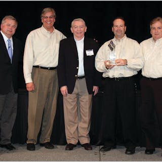 At the awards presentation were Roger Toomey, left, of UniPro Foodservice; Rich Vecchia, Sugar Foods Corp.; Ray Goldman, UniPro Foodservice; Chris Travisano and Mike Hannigan, both of Sugar Foods.