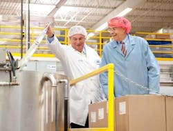 President of Promotion In Motion, Michael Rosenberg, gives U.S. Representative Rush Holt a peek into the cooking processes around the Promotion In Motion facility in Somerset, NJ. President of Promotion In Motion, Michael Rosenberg, gives U.S. Representative Rush Holt a peek into the cooking processes around the Promotion In Motion facility in Somerset, NJ.