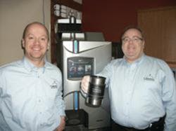 Cafection executives Frank Baron, left, and Denis Maillé proudly celebrate a record sales month. Cafection executives Frank Baron, left, and Denis Maillé proudly celebrate a record sales month.