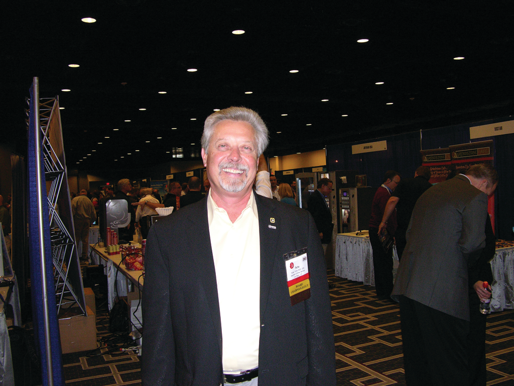Pete Tullio, CFO of Gourmet Coffee Service Inc. in Van Nuys, Calif., and National Automatic Merchandising Association (NAMA) chairman of the board-elect walks the floor at CoffeeTea & Water 2012.