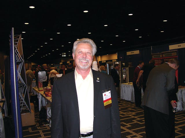 Pete Tullio, CFO of Gourmet Coffee Service Inc. in Van Nuys, Calif., and National Automatic Merchandising Association (NAMA) chairman of the board-elect walks the floor at CoffeeTea &amp; Water 2012.