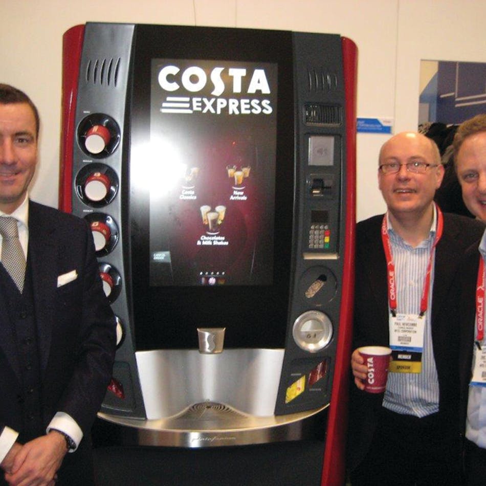 Jim Slater of Costa, left, Paul Newcombe of Intel Corp. and Eric Achtmann of Costa exhibit the multi-sensory experience single-serve hot beverage machine at the National Retail Federation show in January.