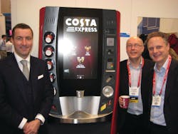 Jim Slater of Costa, left, Paul Newcombe of Intel Corp. and Eric Achtmann of Costa exhibit the multi-sensory experience single-serve hot beverage machine at the National Retail Federation show in January.