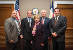 In the back row of the photo, from left to right, is Jon Ford (All State Manufacturing Co.), Tom Reynolds (PepsiCo), Rep. Pete Sessions (R-Texas) and Mark Dieffenbach (The Hershey Co.) In the front row of the photo is Pam Gilbert (NAMA). In the back row of the photo, from left to right, is Jon Ford (All State Manufacturing Co.), Tom Reynolds (PepsiCo), Rep. Pete Sessions (R-Texas) and Mark Dieffenbach (The Hershey Co.) In the front row of the photo is Pam Gilbert (NAMA).