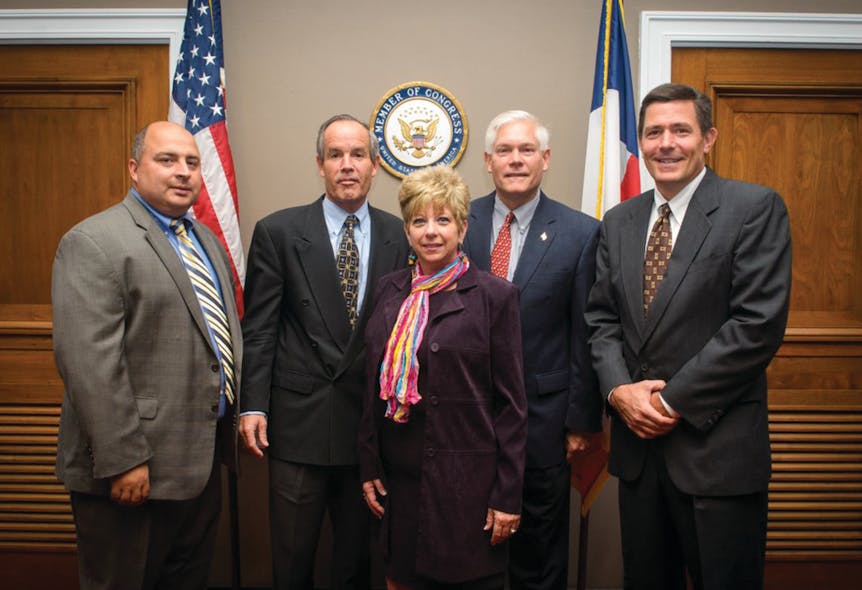 In the back row of the photo, from left to right, is Jon Ford (All State Manufacturing Co.), Tom Reynolds (PepsiCo), Rep. Pete Sessions (R-Texas) and Mark Dieffenbach (The Hershey Co.) In the front row of the photo is Pam Gilbert (NAMA).