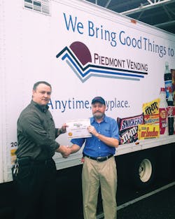 Piedmont Vending Operations Manager Jeff Anna presents Mike Hill with a Certificate of Nomination.