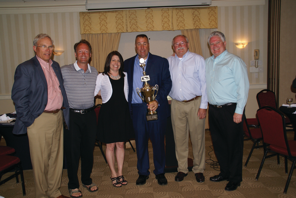 Harry Wishart Award winners, Lloyd 'Bud' Willey'08, left, Todd Hedrich'04, Melissa Johnson'11, Jeff Terban'14, Dennis Surprenant'13, Steve Foley'12, pose together at the New England Spring Meeting.